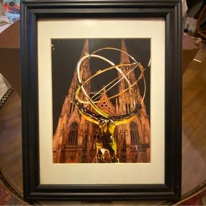Picture behind statue Atlas and St. Patrick’s Cathedral